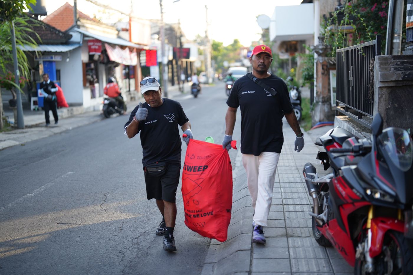 The Sweep on the streets of Bali at sunrise